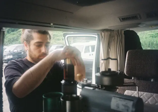 Brewing with an AeroPress inside the camper.